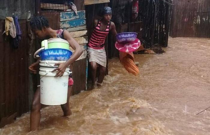 zinc-sheet houses flooded in slums