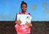 African kid with school supplies