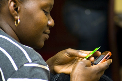 a woman operating her mobile phone