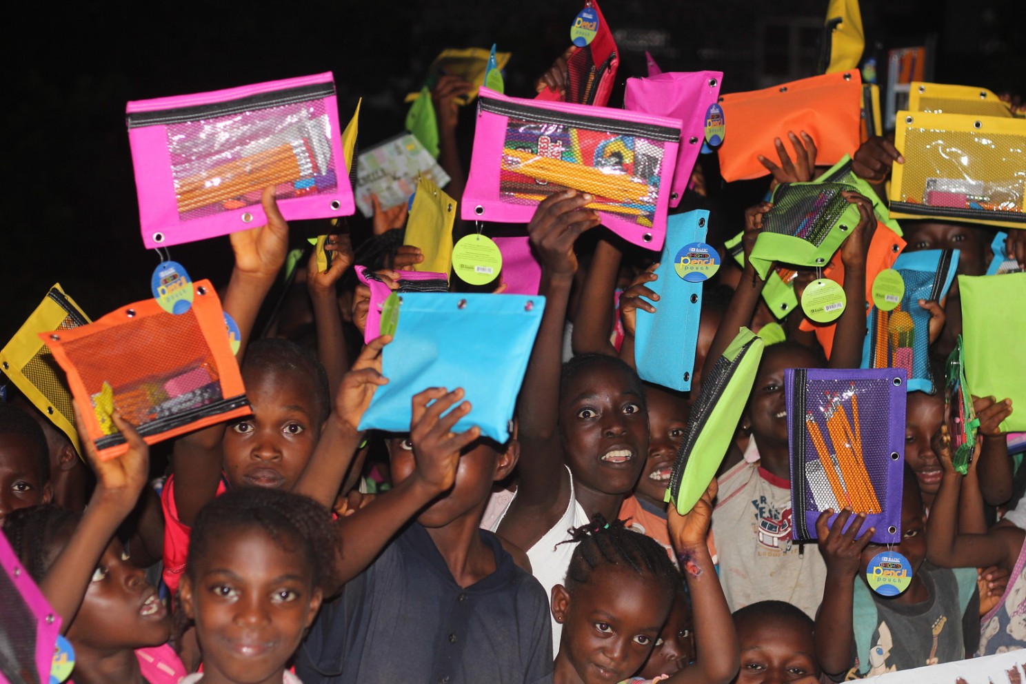 kids receiving school supplies